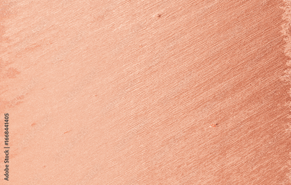 Fototapeta premium Peach plaster wall texture with soft rough surface and gradient shades, warm abstract background for design, art, and decoration.