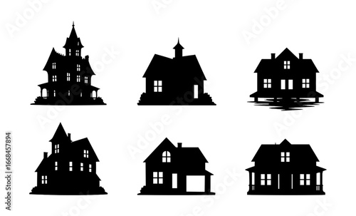 Dark silhouettes of haunted houses on spooky background