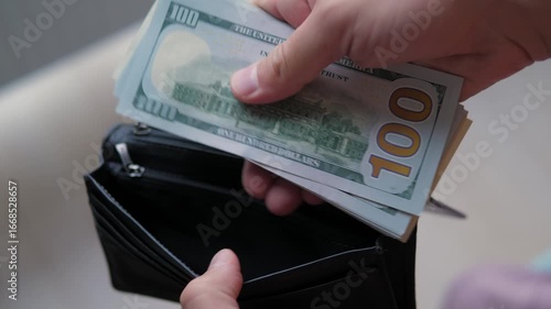 Counted the dollars and put them back in the wallet