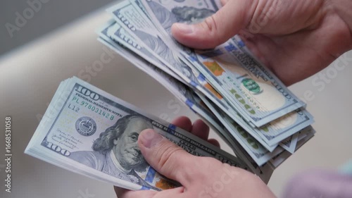 Man Counting Dollar Bills Close-Up