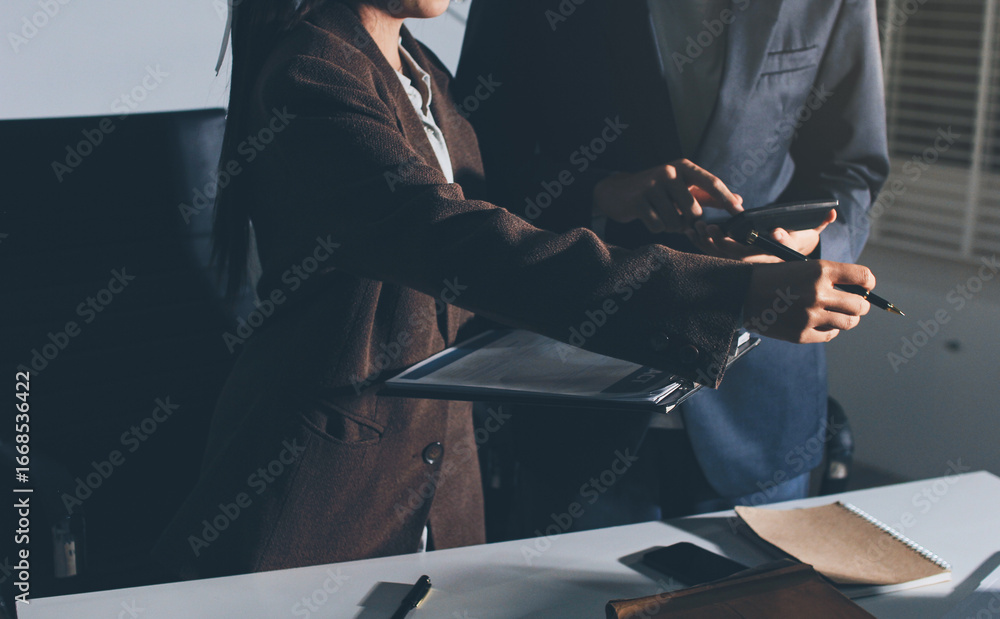 Fototapeta premium Lawyer explained to the client about the law that must be brought against the court case.