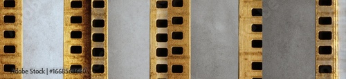 Multiple strips of aged film stock with perforations
