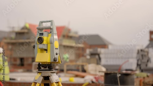 Surveying equipment setup on a construction site for precise measurements and planning of new buildings during the day