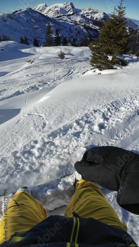 POV footage of a man snowboarding in Avoriaz, France. Action camera captures the ride on snowy slopes during winter, showing speed, snow, and alpine atmosphere