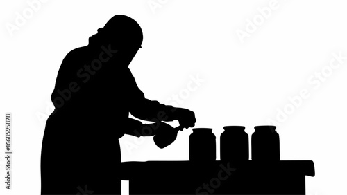 Silhouette of a person filling jars with a spoon on a table in a canning or preserving process scene