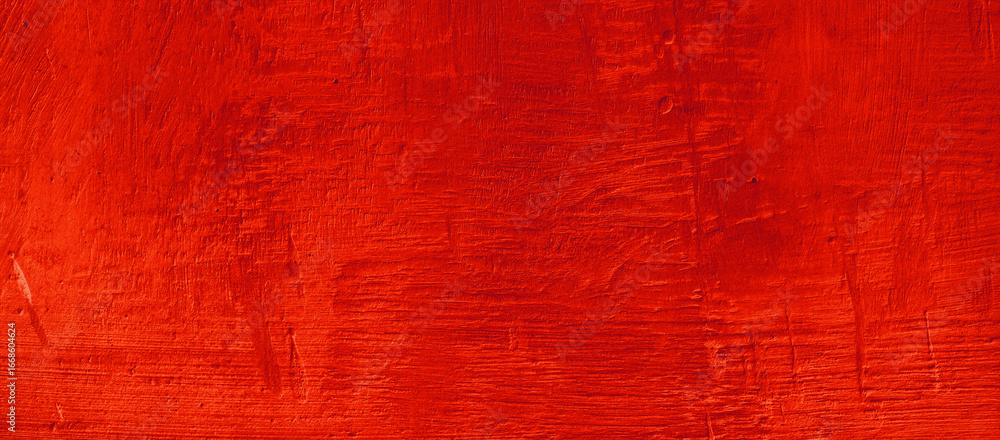 Obraz premium Abstract vibrant red wooden background texture. Perfect for backgrounds, design projects, websites, prints, and artistic compositions requiring a bold touch.