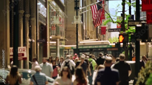 Busy Urban Street In New York City With American Flag, Crowds Of People, Traffic, Architecture And Vibrant City Life Representing Tourism, Culture, Business And Daily Urban Lifestyle.