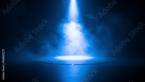 Blue Spotlight with Mist on Dark Stage Creating Dramatic Ambience