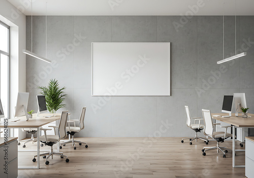 A blank horizontal frame on a concrete wall in a modern open-plan office. A perfect mockup for displaying corporate branding, posters, or art.


