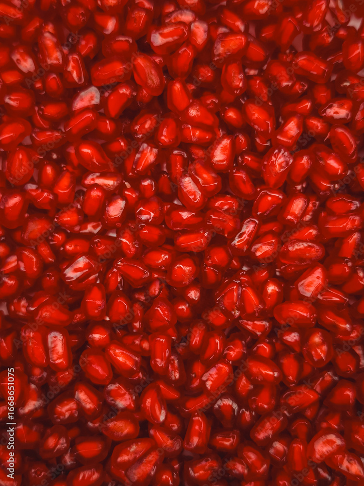 Juicy pomegranate seeds creating vibrant red background for rosh hashanah Juicy pomegranate seeds creating vibrant red background for rosh hashanah