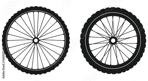 Bicycle wheels with black tires and spokes on white background