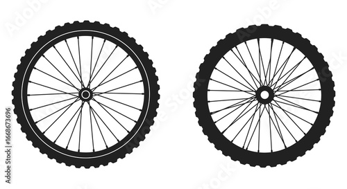 Bicycle wheels with black tires and spokes on white background