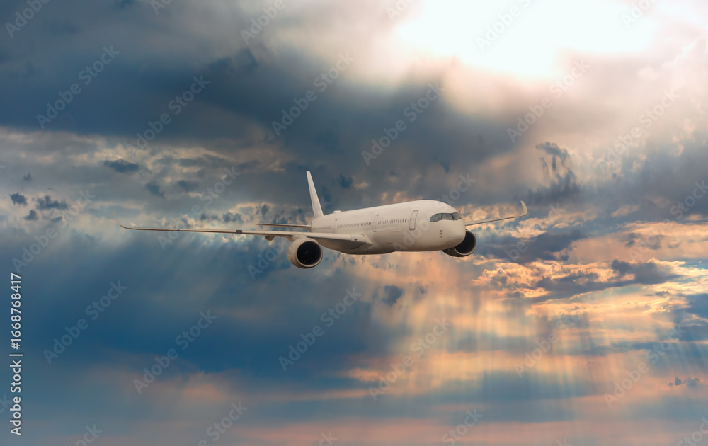 Fototapeta premium Airplane flying over tropical sea at sunset