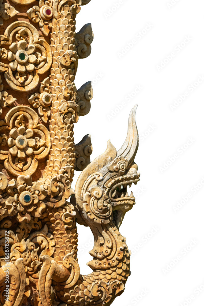Fototapeta premium The beautiful golden Naga wood carved pillars, a symbol of the Lanna culture of northern Thailand, are ancient and appear on the temple wall.