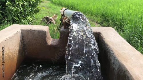Water flowing from concrete irrigation channel