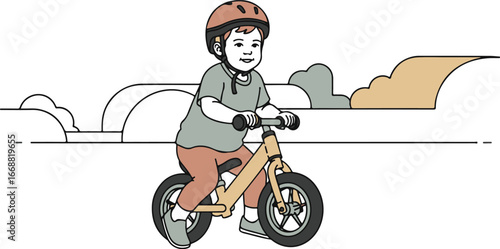 Smiling young child in a protective helmet happily riding a yellow wooden balance bike.