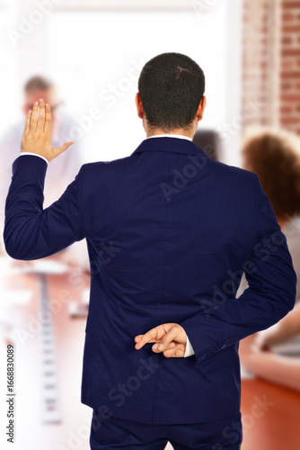 Rear view of a professional businessman crossing fingers behind back while swearing an oath, symbolizing dishonesty, deception, and a lack of integrity in corporate ethics or personal trust.