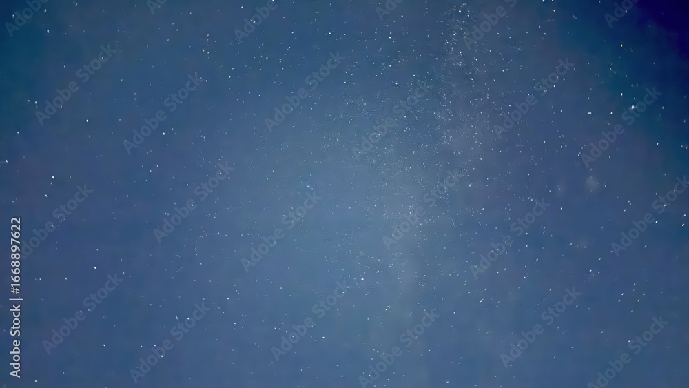 Fototapeta premium deep blue night sky with scattered starlight and faint milky way glow ideal for cosmic background or dreamy texture