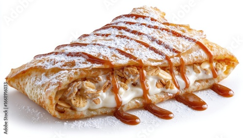 A folded crepe filled with creamy filling and granola, drizzled with caramel sauce and powdered sugar