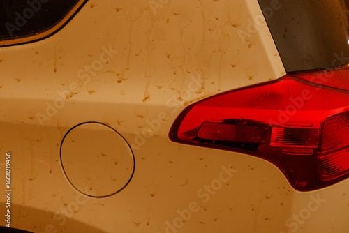 Dust storm haboob rain drops on white Toyota car in tempe phoenix arizona