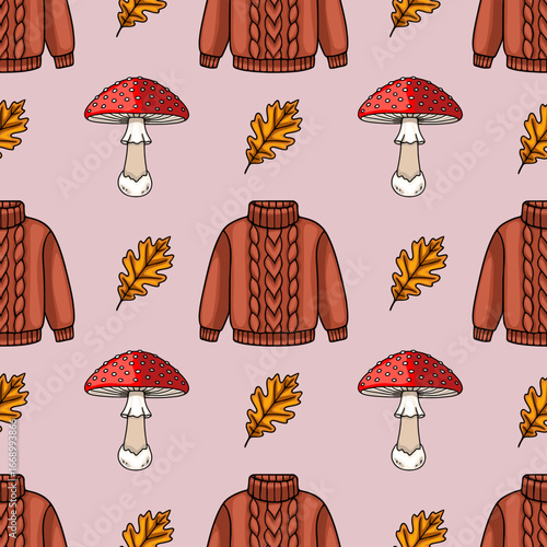 Vászonkép Seamless vector pattern featuring autumnal elements a cozy knitted sweater, vibrant red fly agaric mushrooms, and golden oak leaves, creating a warm and inviting autumnal design
