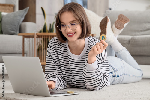 Young woman with bitcoin us...