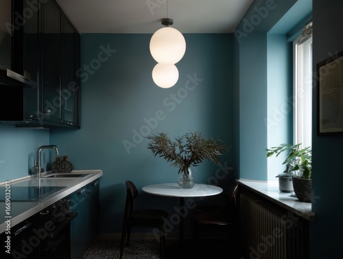 A teal-toned kitchen featur...