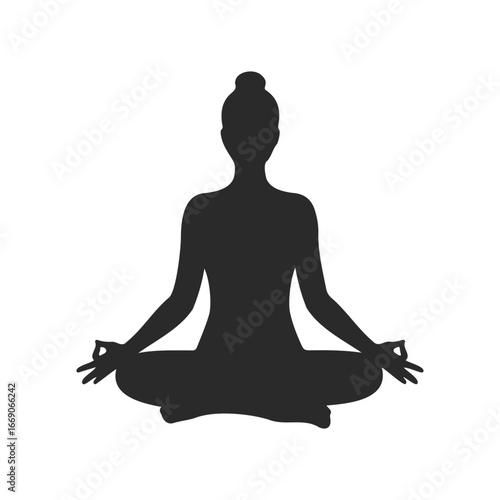 Silhouette of female practicing yoga in lotus position