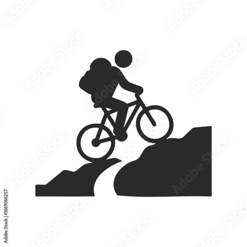 Mountain biking silhouette of person climbing steep hill on bicycle