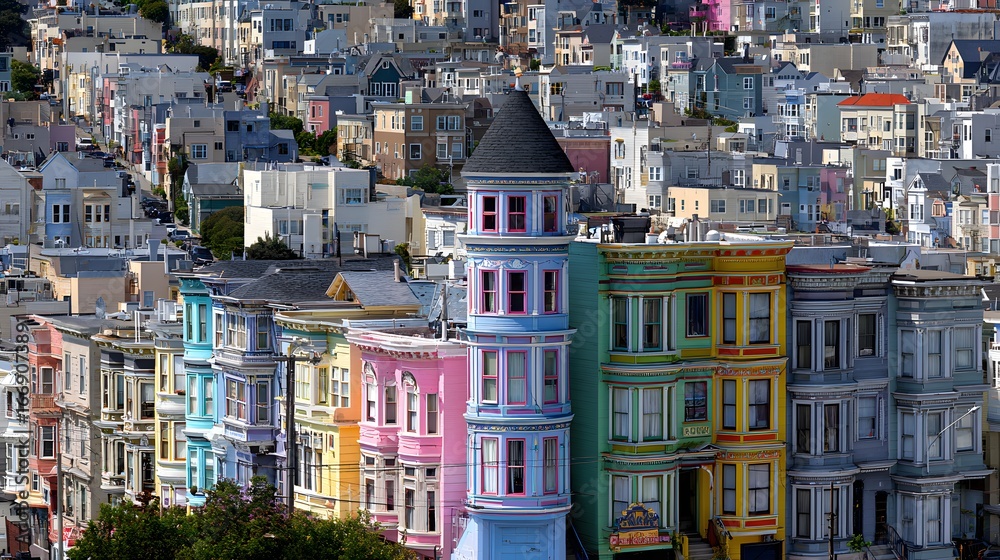 Obraz premium Vibrant, colorful houses line a city street, showcasing a captivating urban landscape.