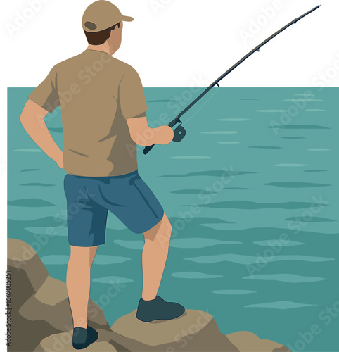 A man is seen from behind while fishing with rods on a rocky shoreline along the ocean