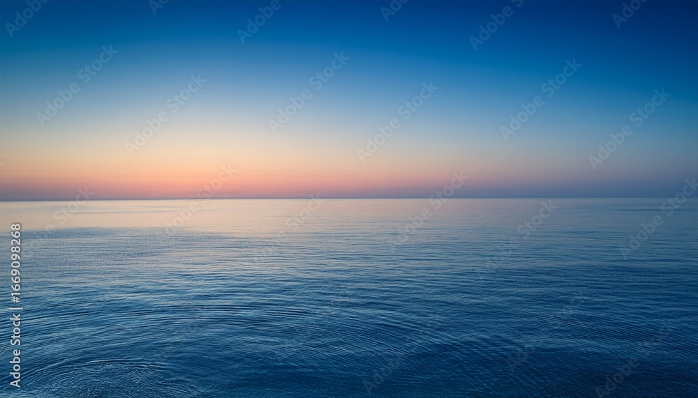 Fototapeta premium serene seascape at dawn a minimalist vista of a tranquil ocean bathed in the soft ethereal glow of sunrise evokes a sense of peace and calm the horizon blends seamlessly with the sky