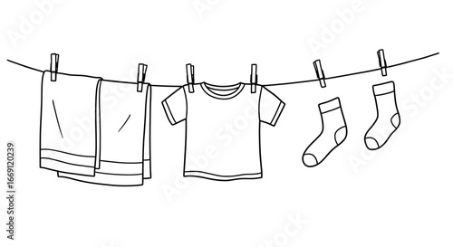 Drying clothes on a washing line with clothespins on a sunny day