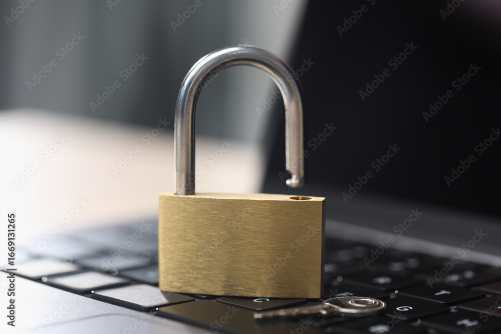 Cyber safety. Metal padlock on laptop, closeup Cyber safety. Metal padlock on laptop, closeup