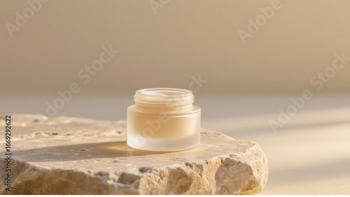 Minimalist frosted glass cosmetic jar with cream, placed on natural stone surface under warm sunlight. Luxury skincare product mockup for organic beauty, spa branding, and cosmetic packaging design.