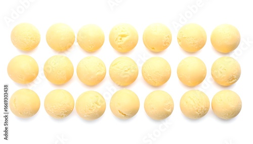 Yellow Ice Cream Scoops Arranged on White Background