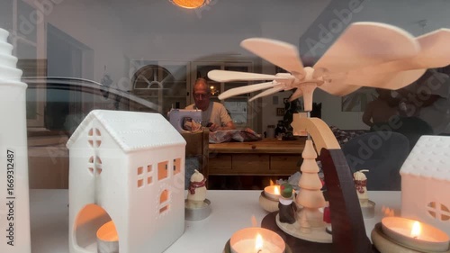 Mature adult tailor is sewing an año viejo doll, a Latin American Ecuadorian tradition representing the old year, in preparation for New Year's Eve celebrations in Amsterdam, Netherlands.