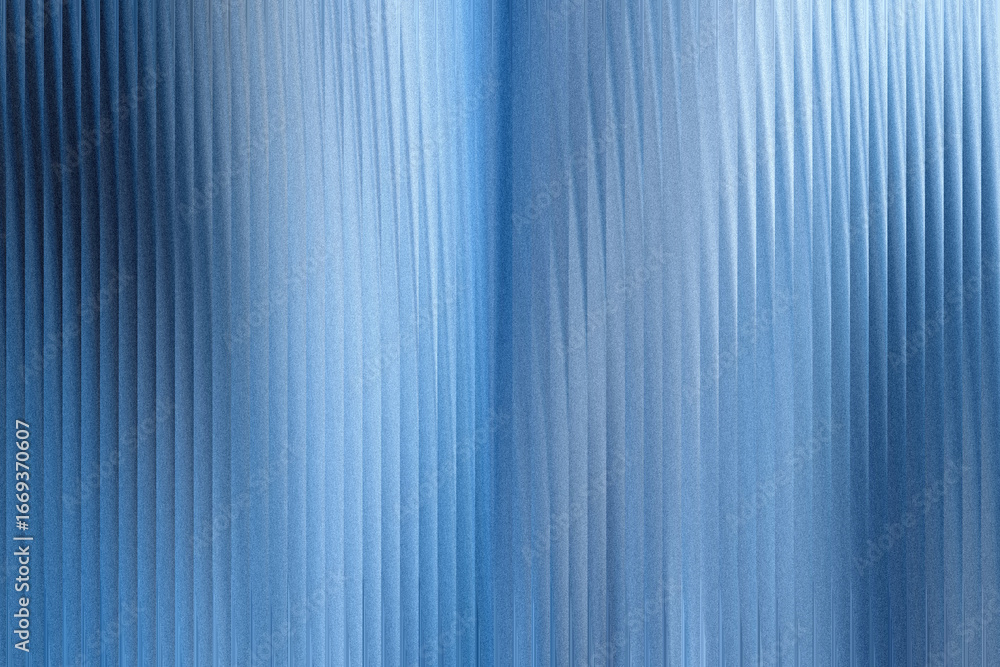 Obraz premium A closeup view of a textured blue surface with vertical ribbed patterns and subtle light reflections, creating an abstract and modern background