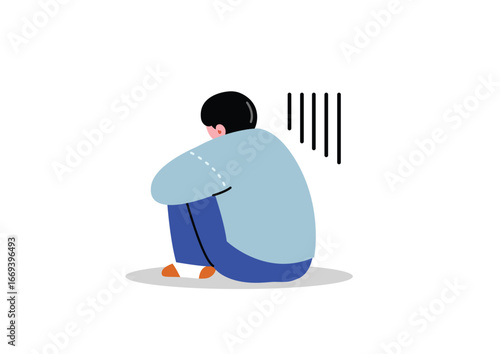 体育座りで落ち込む男性