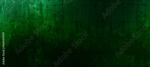 Dark grunge green scary textured background with rough distressed surface and gradient shades for abstract artistic design and creative graphic use