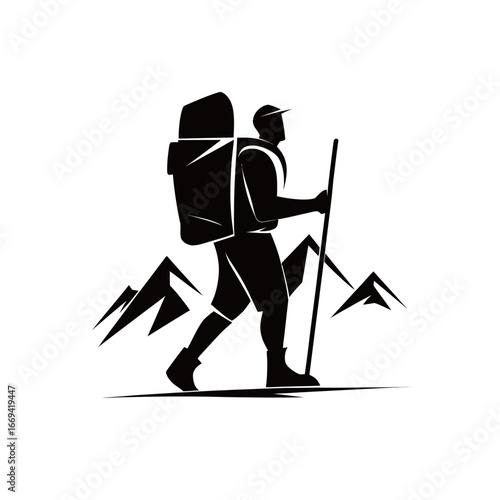 A hiker walks confidently on a rugged trail, equipped with a large backpack, trekking through a mountainous landscape under clear skies. The peaks create a breathtaking backdrop.