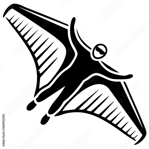 Black and white wingsuit flyer in freefall with sharp wing extensions