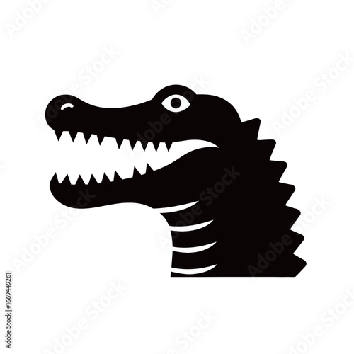 A stylized silhouette of a crocodile head showing its sharp teeth and defining characteristics. This graphic illustrates the reptile's fierce expression and iconic shape.