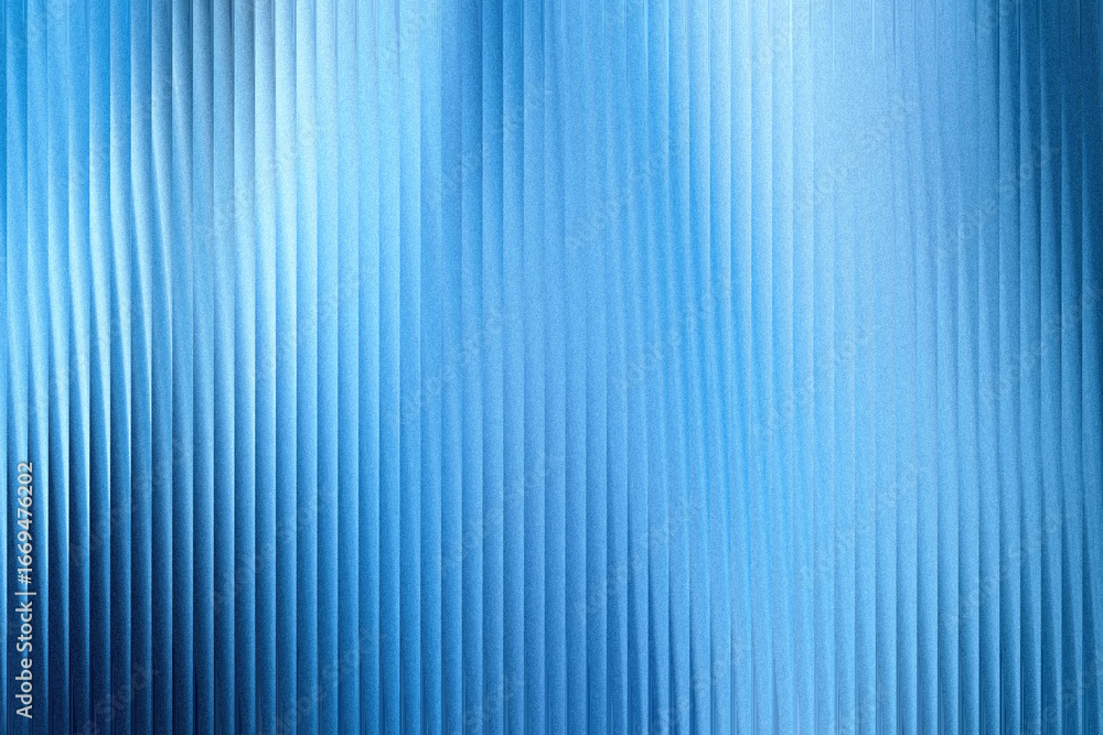 Obraz premium A textured blue background with vertical ribbed patterns and a soft, luminous gradient