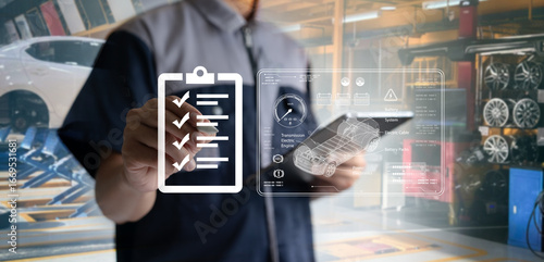 Auto mechanics use tablets with state-of-the-art interactive diagnostic software to find faulty parts in an engine.