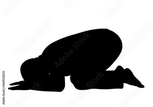 Silhouette of a person kneeling in a prayer position
