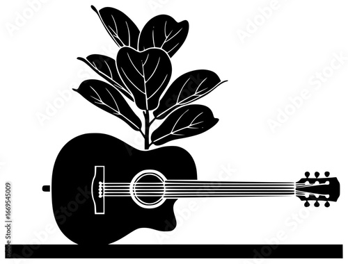 Guitar plant on a desk with big leaves in a modern room and beautiful shape nearby