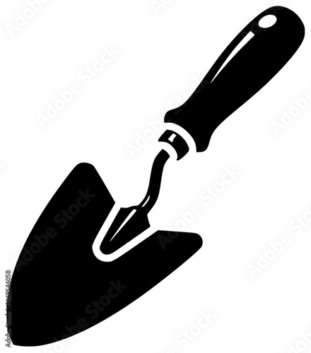 Trowel equipment used for gardening and covered in mud next to soil