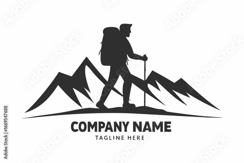 Silhouette depicts a trekker with a backpack hiking through a forest beneath majestic mountains
