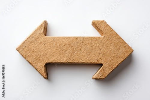 Textured cardboard arrow pointing in opposite directions against a white background